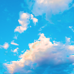 a blue sky with lots of clouds. also the app icon for bluesky